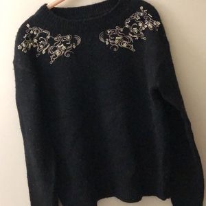 Black sweater with golden bead